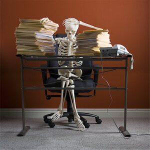 Your desk is dispersed with piles of scathed papers